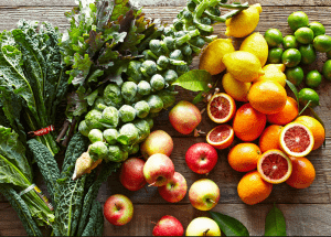 a group of fruits and vegetables on a wood surface Healthy Weight Loss Diets Leominster