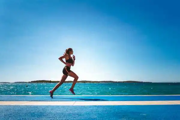 Woman running showing strong leg muscle Leominster